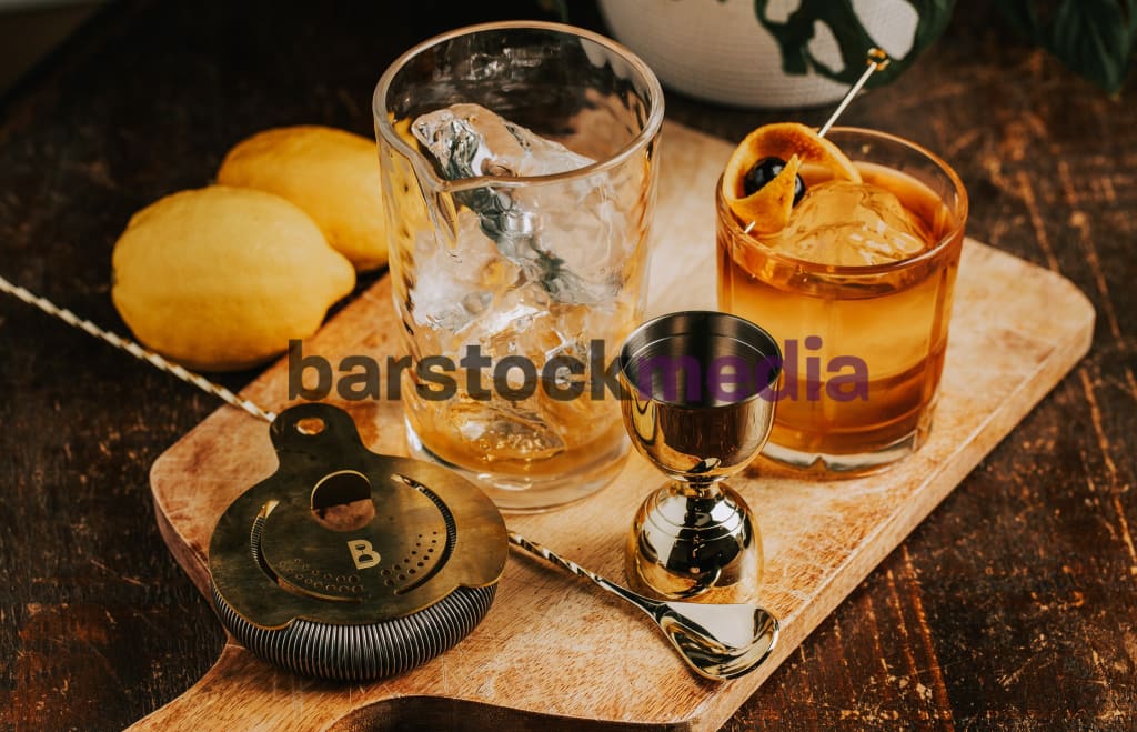 Old Fashioned With Bar Tools On Wood Table Photo