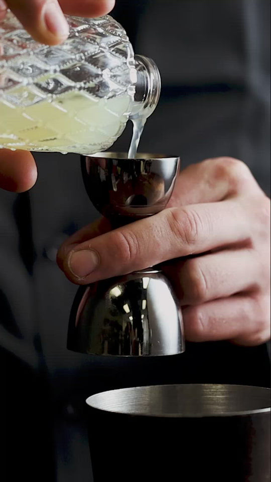 Shaken Citrus Cocktail in Crosshatch Glass Over Ice