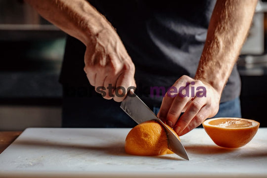 Bartender Prepping Orange Garnishes
