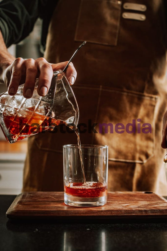 Mixing Glass Pour of a Sazerac in a Home
