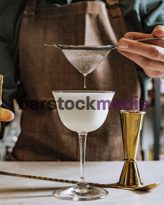 Egg White Sour Drip With Bar Tools Around